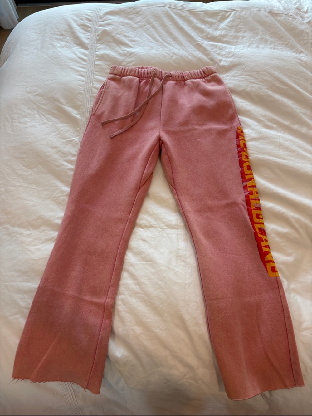 PacSun Pink Sweatpants with Yellow-Red Side Graphic